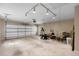 Spacious two-car garage featuring ample lighting, a large door, and generous room for storage and activities at 191 Orchard Dr, Canton, GA 30115