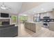 View of the open floor plan with stone fireplace, kitchen, and access to the rear deck at 191 Orchard Dr, Canton, GA 30115