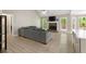 Bright living room features vaulted ceilings, fireplace, large windows, and access to deck at 191 Orchard Dr, Canton, GA 30115