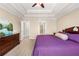 Spacious bedroom with tray ceilings and view of the green space and walk in closet at 191 Orchard Dr, Canton, GA 30115