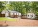 Spacious backyard featuring a large deck, outbuilding, and lush green lawn at 2086 Harold Se Ave, Smyrna, GA 30080