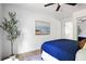 Well-lit bedroom with ample natural light, coastal artwork, and sleek ceiling fan adds to the space at 2086 Harold Se Ave, Smyrna, GA 30080