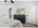 Bedroom boasts hardwood floors, ample storage with black dresser, and plenty of natural light at 2086 Harold Se Ave, Smyrna, GA 30080