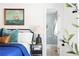 Bright bedroom features a maritime painting and ensuite bath with tiled shower and glass door at 2086 Harold Se Ave, Smyrna, GA 30080