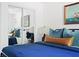 Stylish bedroom with mirrored closet doors, and a comfortable bed adorned with plush pillows and bedding at 2086 Harold Se Ave, Smyrna, GA 30080