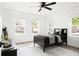 Bright bedroom with hardwood floors, ceiling fan and great natural light from the large windows at 2086 Harold Se Ave, Smyrna, GA 30080