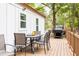 Open deck with dining table, chairs and BBQ grill perfect for outdoor entertainment at 2086 Harold Se Ave, Smyrna, GA 30080