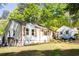 Charming single-story home featuring white siding, a cozy front yard, and a classic American flag at 2086 Harold Se Ave, Smyrna, GA 30080