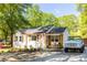 Renovated cottage-style home features a new roof, a classic car, and a gravel driveway at 2086 Harold Se Ave, Smyrna, GA 30080