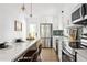 Bright, updated kitchen with stainless steel appliances, white cabinets, and an island with breakfast bar at 2086 Harold Se Ave, Smyrna, GA 30080