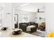 Cozy living room featuring a sectional sofa, area rug, and view into the kitchen at 2086 Harold Se Ave, Smyrna, GA 30080