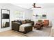Stylishly furnished living room with comfortable seating, a large window, and a trendy ceiling fan at 2086 Harold Se Ave, Smyrna, GA 30080