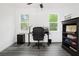 Bright and spacious office with two large windows, desk, chair and storage unit at 2086 Harold Se Ave, Smyrna, GA 30080