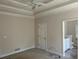 Spacious bedroom featuring a ceiling fan and entry to an ensuite bathroom at 4383 Post Rd, Winston, GA 30187
