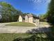 Front exterior view of a two-story home, featuring a large driveway and attached garage at 4383 Post Rd, Winston, GA 30187