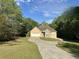 Charming single-story home with a stone accent, a two-car garage, and a welcoming curved driveway at 4383 Post Rd, Winston, GA 30187