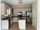 Spacious kitchen featuring stainless steel appliances, an island, and wooden floors at 4383 Post Rd, Winston, GA 30187