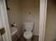 Compact bathroom with a toilet and sink at 4909 Farm Valley Ne Dr, Woodstock, GA 30188