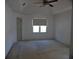Spacious bedroom with a vaulted ceiling and natural light from a large window at 4909 Farm Valley Ne Dr, Woodstock, GA 30188