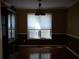 Inviting dining room with hardwood floors and large window at 4909 Farm Valley Ne Dr, Woodstock, GA 30188