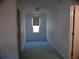 Bright hallway features a window and neutral walls at 4909 Farm Valley Ne Dr, Woodstock, GA 30188