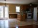 Functional kitchen with light wood cabinets, appliances, and a breakfast bar at 4909 Farm Valley Ne Dr, Woodstock, GA 30188