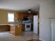 Functional kitchen with light wood cabinets, appliances, and a breakfast bar at 4909 Farm Valley Ne Dr, Woodstock, GA 30188