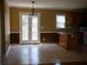 Functional kitchen with light wood cabinets, appliances, and a breakfast bar at 4909 Farm Valley Ne Dr, Woodstock, GA 30188