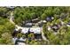 An aerial view of the home and community, showcasing lush greenery and beautiful landscape at 9062 Selborne Ln, Palmetto, GA 30268