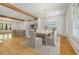 Open dining room features a modern chandelier and is adjacent to the kitchen and breakfast bar seating at 9062 Selborne Ln, Palmetto, GA 30268