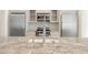 A kitchen with stainless appliances, modern fixtures, white cabinets, and a granite countertop at 9062 Selborne Ln, Palmetto, GA 30268