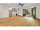 Living room with wet bar featuring stainless steel appliances and large sliding doors to patio at 9062 Selborne Ln, Palmetto, GA 30268