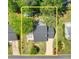 Overhead view of home and yard featuring mature trees and landscaping at 115 Braided Blanket Blf, Johns Creek, GA 30022