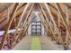 Spacious attic with exposed beams, flooring, and ample storage space at 115 Braided Blanket Blf, Johns Creek, GA 30022