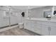 Bright bathroom featuring a large walk-in shower with glass door, and a double sink vanity at 115 Braided Blanket Blf, Johns Creek, GA 30022