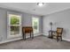 Bright bedroom featuring two large windows, neutral colored walls, plush carpet, and tasteful decor at 115 Braided Blanket Blf, Johns Creek, GA 30022