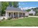Inviting home with a charming front porch, well-maintained landscaping, and attached garage at 115 Braided Blanket Blf, Johns Creek, GA 30022