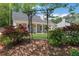 Beautiful home with an arched trellis and vibrant landscaping, adding curb appeal at 115 Braided Blanket Blf, Johns Creek, GA 30022