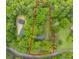 An aerial view shows property lines of a home enveloped by a dense, green canopy of trees at 1943 Scott Rd, Canton, GA 30115
