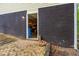 Exterior view of unfinished basement with exposed dark brick and doorway at 1943 Scott Rd, Canton, GA 30115