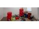 Basement view with storage containers and assorted tools at 1943 Scott Rd, Canton, GA 30115