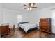 Traditional bedroom featuring dark wood floors, a ceiling fan, and built in dresser at 1943 Scott Rd, Canton, GA 30115