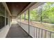 Charming front porch with views of the landscaped front yard, perfect for enjoying peaceful moments at 1943 Scott Rd, Canton, GA 30115