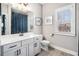 Bathroom features a single vanity, a window, and modern fixtures at 2005 Etris Manor Dr, Roswell, GA 30075