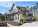 Stately two-story home with a covered porch, three-car garage, and lush landscaping for added privacy at 2005 Etris Manor Dr, Roswell, GA 30075