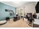 Spacious home office offers ample workspace, a comfortable sitting area, and natural light at 2005 Etris Manor Dr, Roswell, GA 30075