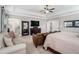 Spacious main bedroom with a sitting area, tray ceiling, and view to the ensuite bath at 2005 Etris Manor Dr, Roswell, GA 30075