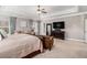 Luxurious main bedroom suite features a sitting area, tray ceiling, and ample natural light at 2005 Etris Manor Dr, Roswell, GA 30075