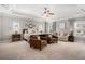 Spacious main bedroom with a tray ceiling, sitting area, and abundant natural light from large windows at 2005 Etris Manor Dr, Roswell, GA 30075