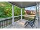 The back porch has a stone tile floor, an outdoor ceiling fan, and a view of the fenced in backyard at 2582 Corey Park Dr, Loganville, GA 30052